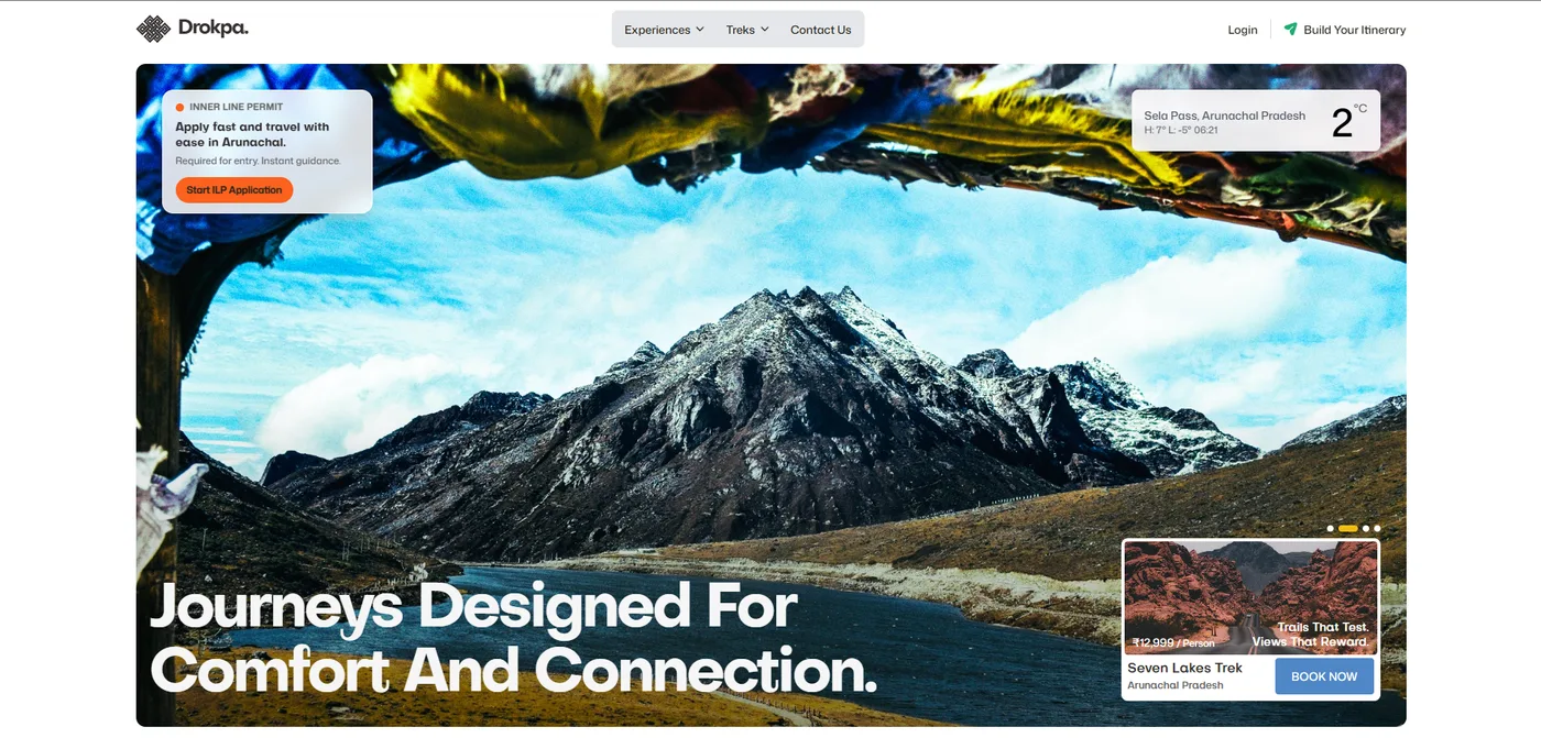 Drokpa travel platform homepage — snow-capped mountains in Arunachal Pradesh framed by prayer flags, with trek booking and itinerary tools